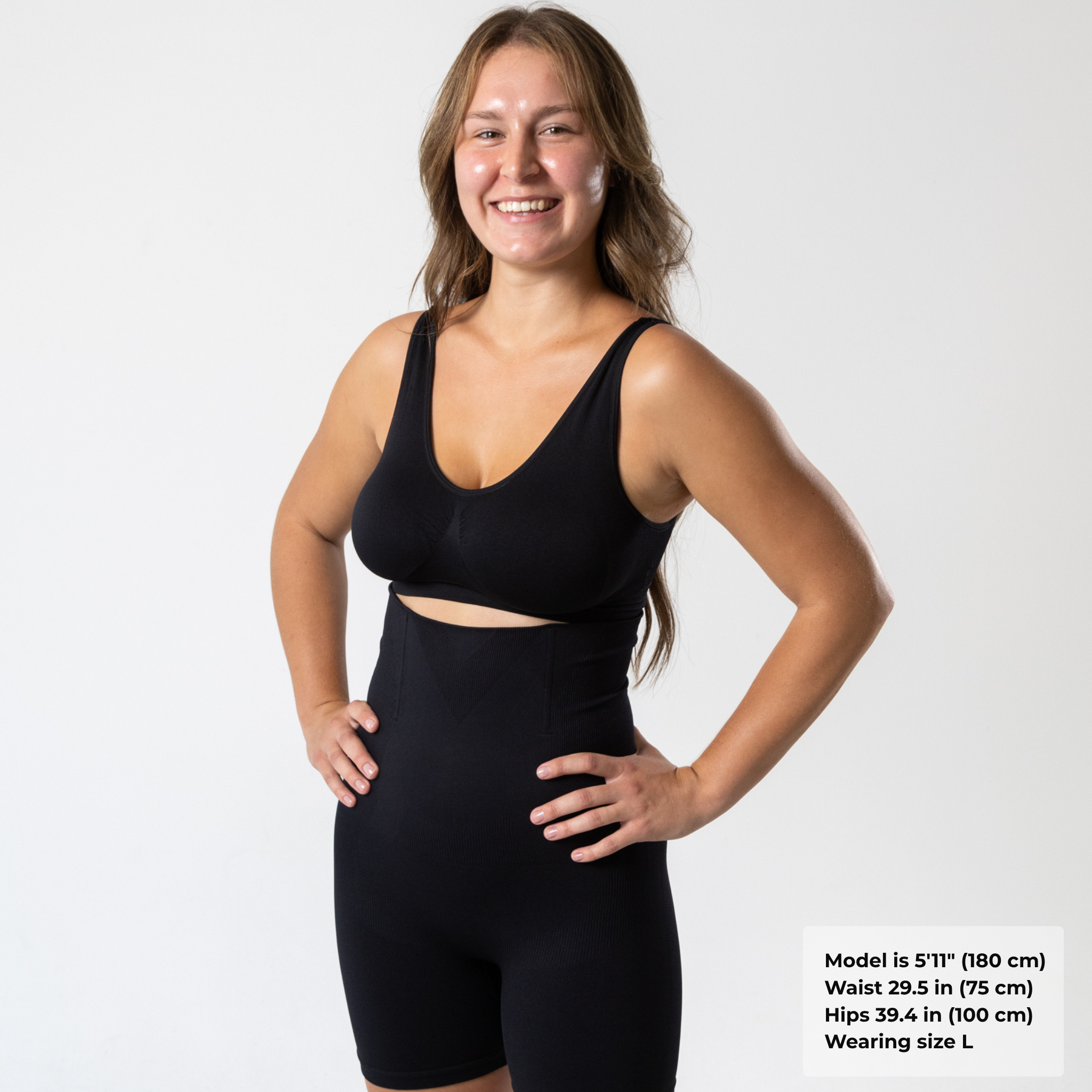 Woman wearing black KORFORM™ high-waisted compression shorts with supportive waistband